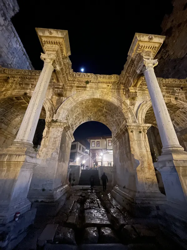 The triple-arched marble Hadrian’s Gate in Antalya, lit up at night