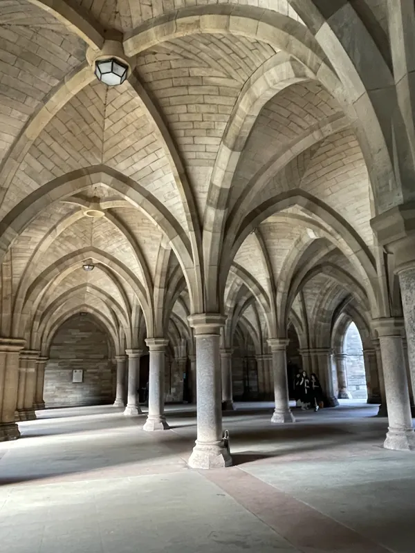 Fan-vaulted stone cloisters with slender columns at the University of Glasgow