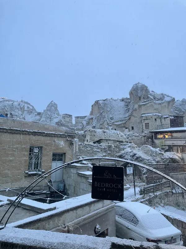 Fresh snow on rooftops and rock houses in Göreme
