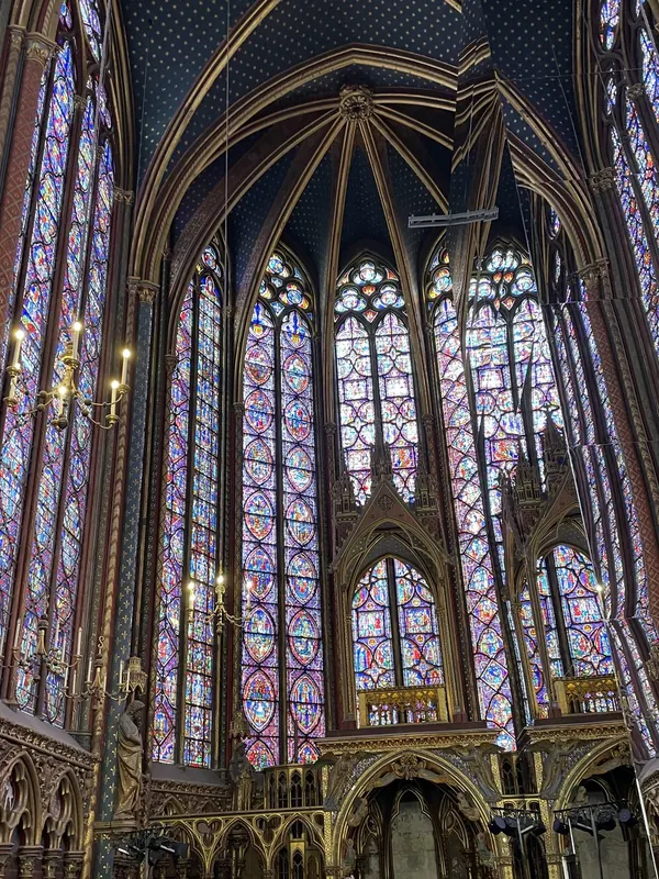 Towering stained-glass windows and a starry blue vault inside Sainte-Chapelle